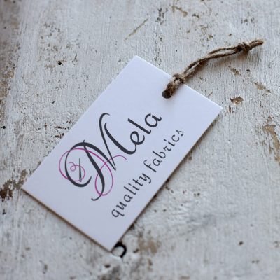 Mela Fabrics Logo Design